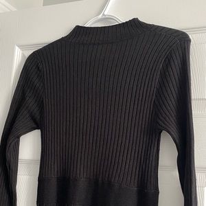 Small, long, black bodycon dress.